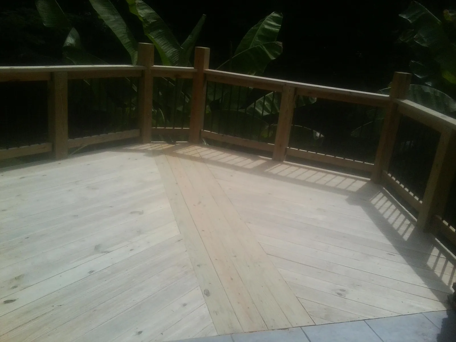 New wood deck and railing built off the back of a home in Cullman